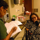 Olivia describes her current state of mental and physical distress to a nurse at the hospital.