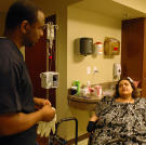Before Olivia's surgery was arranged, she underwent a 48-hour observation period at the hospital. During that time, nurses like this one worked with her on tasks like balancing and walking.