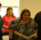 Olivia steels herself and walks down the corridor of the hospital.
