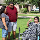 Olivia rests after taking a walk outside and discusses her progress with her brother and sister-in-law.