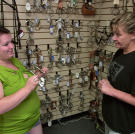 Pony play addict, Nicole, asks the storeowner to help her find a new bit for her costume.