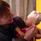 Cat incorporates her doll Volo into all aspects of her life.
