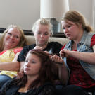 After Mother’s Day breakfast, Aspyn, Madison, Mykelti, and Mariah hang out on the couch.