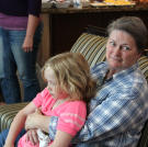 Grandma Sheryl (Janelle’s mom), holds Savanah on her lap.