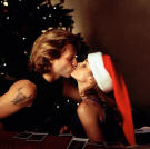 Jon Bon Jovi and Cindy Crawford embrace during the music video shoot for