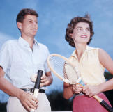 John and Jackie, engaged to be married, play tennis together.