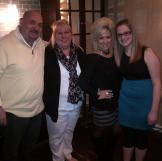 Theresa Caputo with contest winner Tina Maria and her husband and daughter.