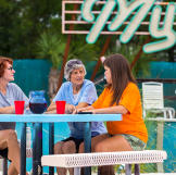 Anne, Miss Peggy and Amanda having a drink by the pool.