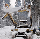 A Russian log loader in the snow.