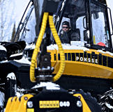 Josiah Heiser in the forwarder. Forwarders are used to move logs from the location where they are cut.