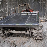 Old Russian skidder. The continuous track propulsion, also called "tank tread" helps the machine move over soft or unstable ground without sinking.