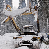 A Russian log loader in the snow.