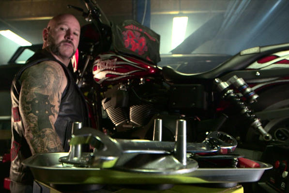 Prospect Rob working on a bike