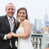 Andrea and Patrick took a moment to pose with the New York skyline behind them.