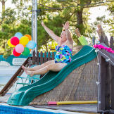 Becky makes a splash on the water slide.