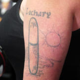 Before: Amanda shows off her hated tattoo, which she says gets mistaken for a ‘sexual apparatus.'