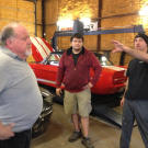 Wayne Varley (a.k.a. Varley), Anthony Makos (a.k.a. Tony) and Joseph Stettinger go over race strategy in the shop.