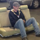 Tyler Priddy (a.k.a. Flip) takes a break on an old car seat.