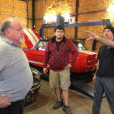 Wayne Varley (a.k.a. Varley), Anthony Makos (a.k.a. Tony) and Joseph Stettinger go over race strategy in the shop.