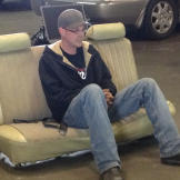 Tyler Priddy (a.k.a. Flip) takes a break on an old car seat.