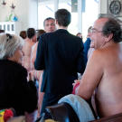 Nudists and textiles chat at the cocktail mixer.
