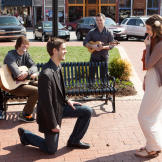 Derick gets down on one knee, and Jill can't help but smile.
