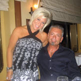 Now, with shorter, blonder hair, Theresa poses with her husband Larry.
