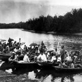 Sea gypsies navigate their boats through a river near Bangkok, Thailand.