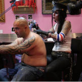 The process, depending on the design, complexity and location, can take a long time. Kat first outlines, then shades in the spaces for depth, and finally adds color as the tattoo requires.