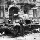 During the courageous yet doomed Warsaw Uprising, a courier poses in front of destroyed Italian Fiat M14/41 tank, August 22, 1944.
Watch video of the