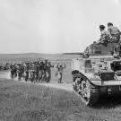 German troops surrender to the crew of a Stuart tank near Frendj, Tunisia, May 1943.