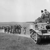 German troops surrender to the crew of a Stuart tank near Frendj, Tunisia, May 1943.