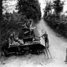 American aviators inspect their handy work, a destroyed Panzer V, during the Battle of Normandy, 1944.
Watch video of the