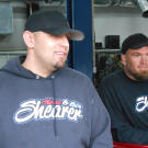 Justin Shearer (a.k.a. Big Chief) and Shawn Ellington (a.k.a. Murder Nova) hang out in the shop.