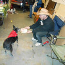 Louise sniffs her birthday cake that Sean Whitley (a.k.a. Farmtruck) is handing her.