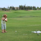 Jen practices her golf swing at the Waikoloa Beach Resort in Hawaii. Just like on their honeymoon, this couple doesn't just bum around in paradise as Jen learns the basics of one of her husband's favorite pastimes.