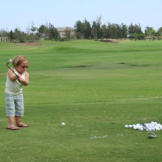 Jen practices her golf swing at the Waikoloa Beach Resort in Hawaii. Just like on their honeymoon, this couple doesn't just bum around in paradise as Jen learns the basics of one of her husband's favorite pastimes.