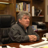 Join us for a look at life on Roloff Farms in Oregon. Here, dad Matt Roloff sits at his desk in the family home. He's got many unique ideas for attracting visitors to the farm, but the best is the pumpkin patch every fall.