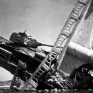 It's a twofer. The wreckage of a bridge and a North Korean tank south of Suwon, Korea. The tank was caught on the bridge and put out of action by the Air Force, October 7, 1950.
Watch