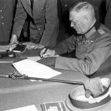 Looking every part the German military bad guy, Field Marshall Wilhelm Keitel signs the unconditional surrender of the German Army at the Soviet headquarters in Karlshorst, Berlin, May 8th, 1945. Keitel would suffer the same fate as Jodl at Nuremberg.