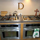 You HAVE to have two ovens and stovetops with all those mouths to feed!