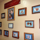 All the children's most precious moments are memorialized on a baby photo wall.