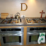 You HAVE to have two ovens and stovetops with all those mouths to feed!
