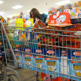 Amanda Ostrowski and her husband get organized with their two full shopping carts.