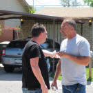 Turf infringement? Scott Menaged and Ed Rosenberg argue after bidding.