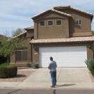 Ed Rosenberg checks out the curb appeal of this auction property.