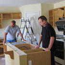 Money pit? Ed Rosenberg and Steve Simons survey the damage to this kitchen.