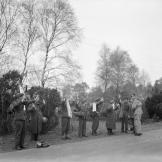 Not one but several German prisoners holding up white handkerchiefs and flags, April 1945.