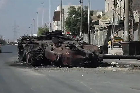 A blown out tank in Aleppo during the Syrian civil war, October 6, 2012.
Watch