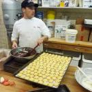 Joey tempers chocolate to drizzle on some holiday cookies.
